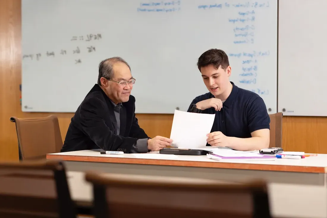 Engineering student Ben Johnson with a professor.